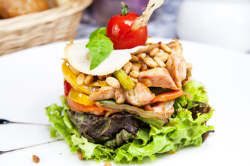 salad greens and vegetables on a plate in a restaurant