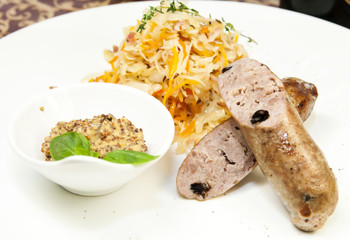 sausage and sauerkraut on a table in a restaurant
