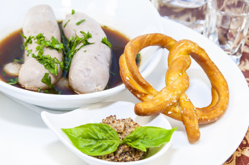sausages in beer sauce with mustard and pastries