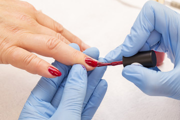 woman doing manicure beauty salon varnish wellness