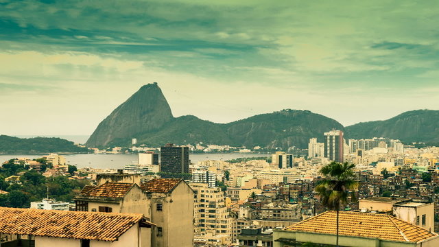 Rio de Janeiro city skyline from above with Sugar Loaf Mountain, Brazil. Time lapse with vintage style colors.