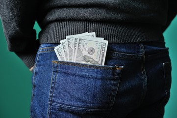 Dollars in the pocket of jeans