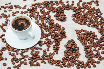 Cup of coffee and beans on beige background with human