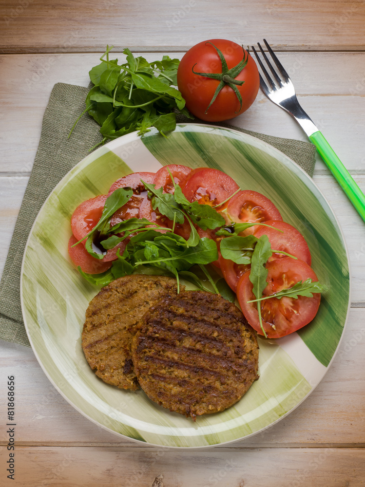 Poster soy steak with arugula and tomatoes salad