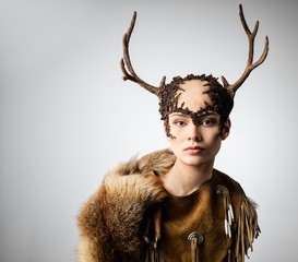 Mythical turnskin woman with deer antlers