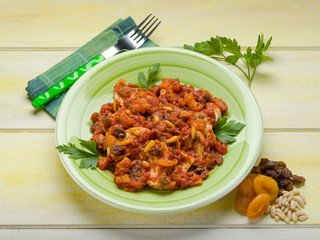 grilled chicken with tomato sauce and dried fruit