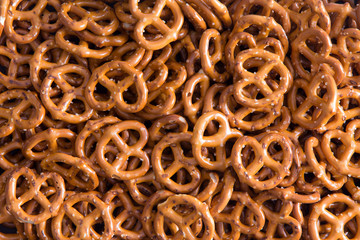 Background texture of mini pretzels - obrazy, fototapety, plakaty