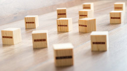 Small Wooden Cubes on a Table for Business Concept