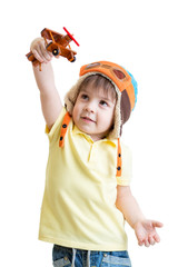 happy kid boy pilot and playing with wooden airplane toy © Oksana Kuzmina