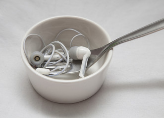 Earplugs with fork in little bowl