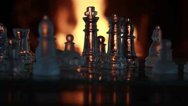 Glass Chess Figures in Front of the Fire
