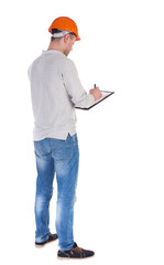 young engineer in a protective helmet with notepad in the hands