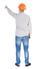 Back view of  pointing young men in  shirt and helmet.