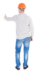 Back view of builder in helmet shows thumbs up.