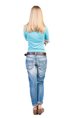 Obraz premium back view of standing young beautiful blonde woman