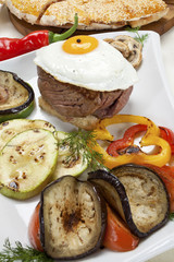 Fillet steak, egg and grilled vegetables
