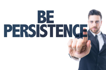 Business man pointing the text: Be Persistence