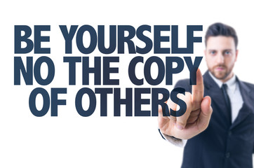 Business man pointingt: Be Yourself Not The Copy of Others