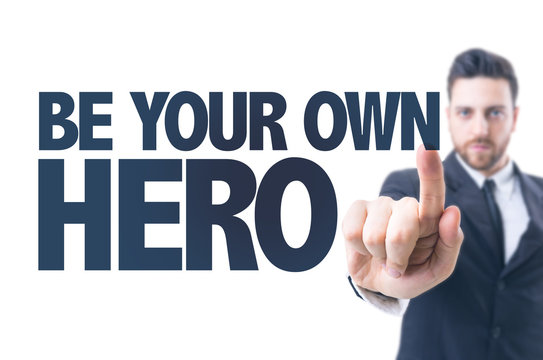 Business man pointing the text: Be Your Own Hero