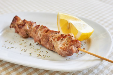 barbecue, grill skewer, pork (or chicken) on wooden grill spits