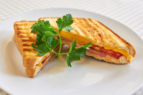 Grilled Panini Sandwiches Stuffed With Ham And Cheese