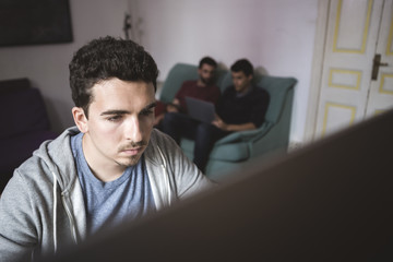 Students with Computer near the windows at home