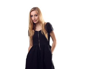 Fototapeta premium A stylish young blonde woman in black dress in little black dres