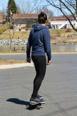 woman riding longboard skateboard outdoor