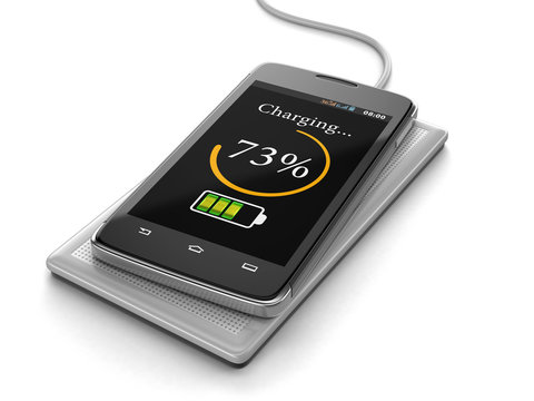 Wireless charging of smartphone (clipping path included)