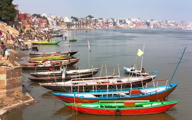 Gordijnen View of Varanasi with boats on sacred Ganga River © Daniel Prudek