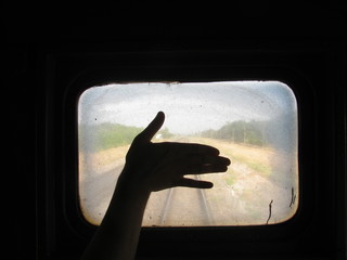 Silhouette Of Hand On A Background Of A Dirty Train Window - 81879419