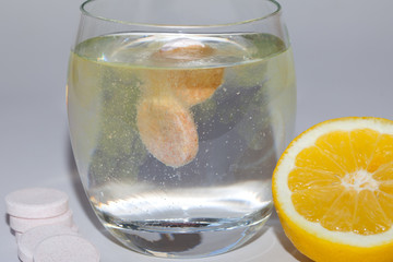 Effervescent tablets in glass of water