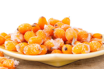 Hippophae rhamnoides on wooden table