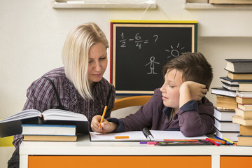 Student during homework with the help of a tutor.