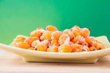 Hippophae rhamnoides on wooden table