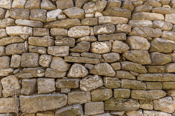 wall of the house lined with stones