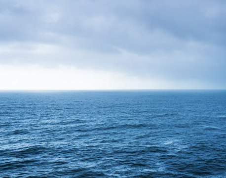 Blue sea landscape and overcast sky