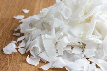 Detail of dried shaved coconut flakes. In perspective.