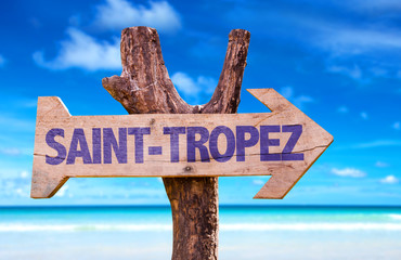 Saint-Tropez wooden sign with beach background