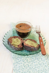 Two slices of cake and cup of black coffee