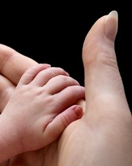 Mother and infant hand