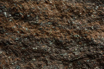 Brown stone with cracks on the surface