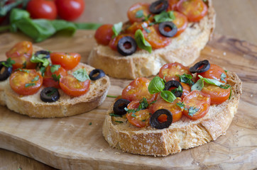 Toasts with tomatoes and olives