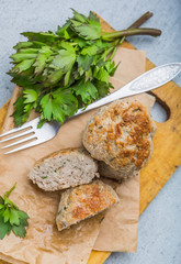 Meatballs with parsley on the kitchen board. Selective focus