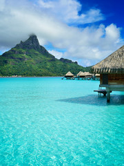 Luxury overwater vacation resort on Bora Bora - obrazy, fototapety, plakaty