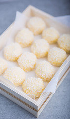 Homemade Coconut Pralines in a wooden box.