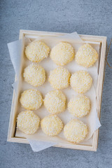 Homemade Coconut Pralines in a wooden box.