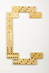 Alphabet letter C arranged from wood dominoes tiles isolated