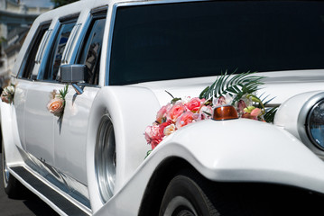 White wedding car with flowers