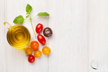 Fresh colorful tomatoes, basil and olive oil